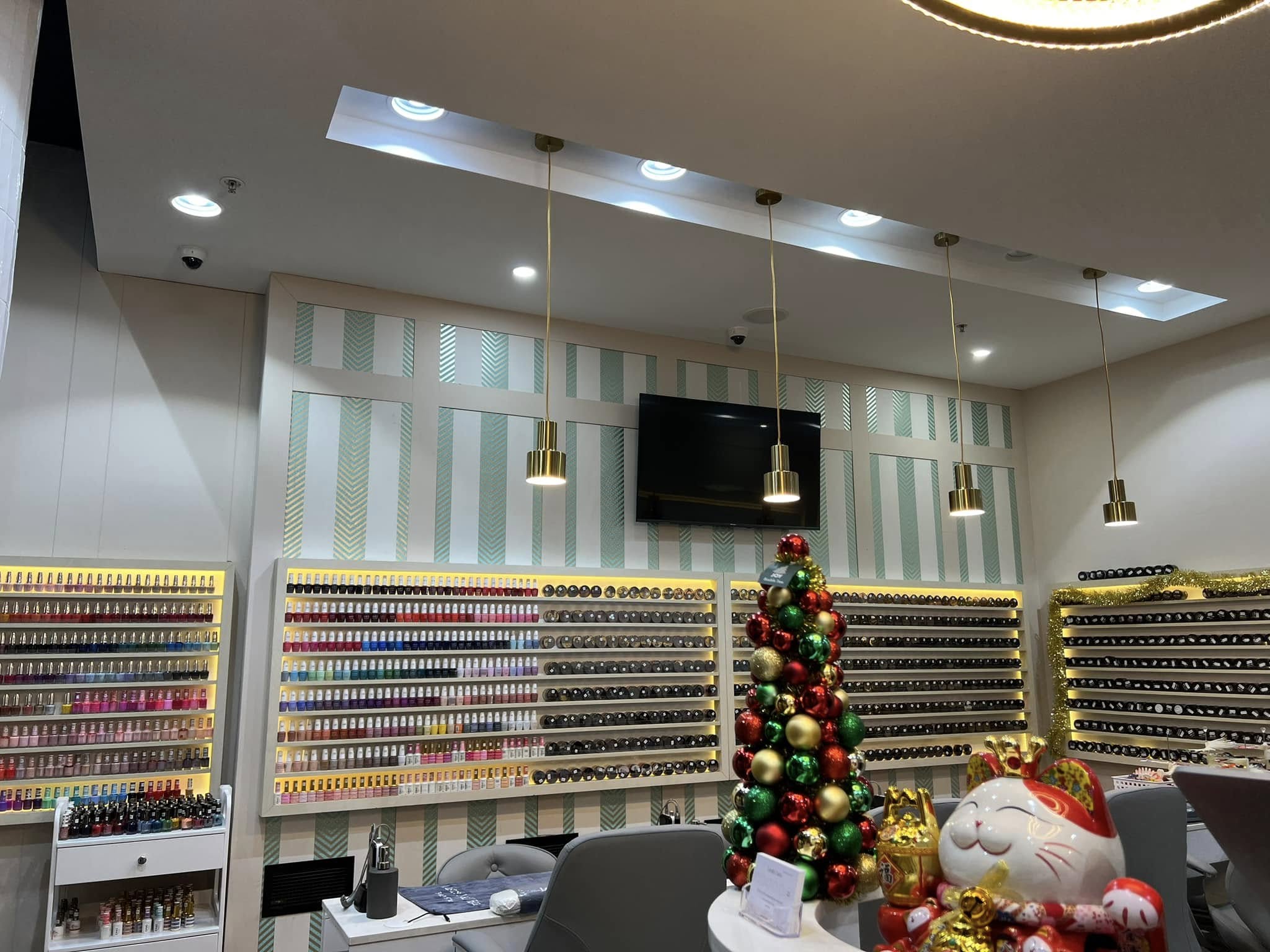 Illuminated nail colour displays at Lustre Nail Bar The Glen