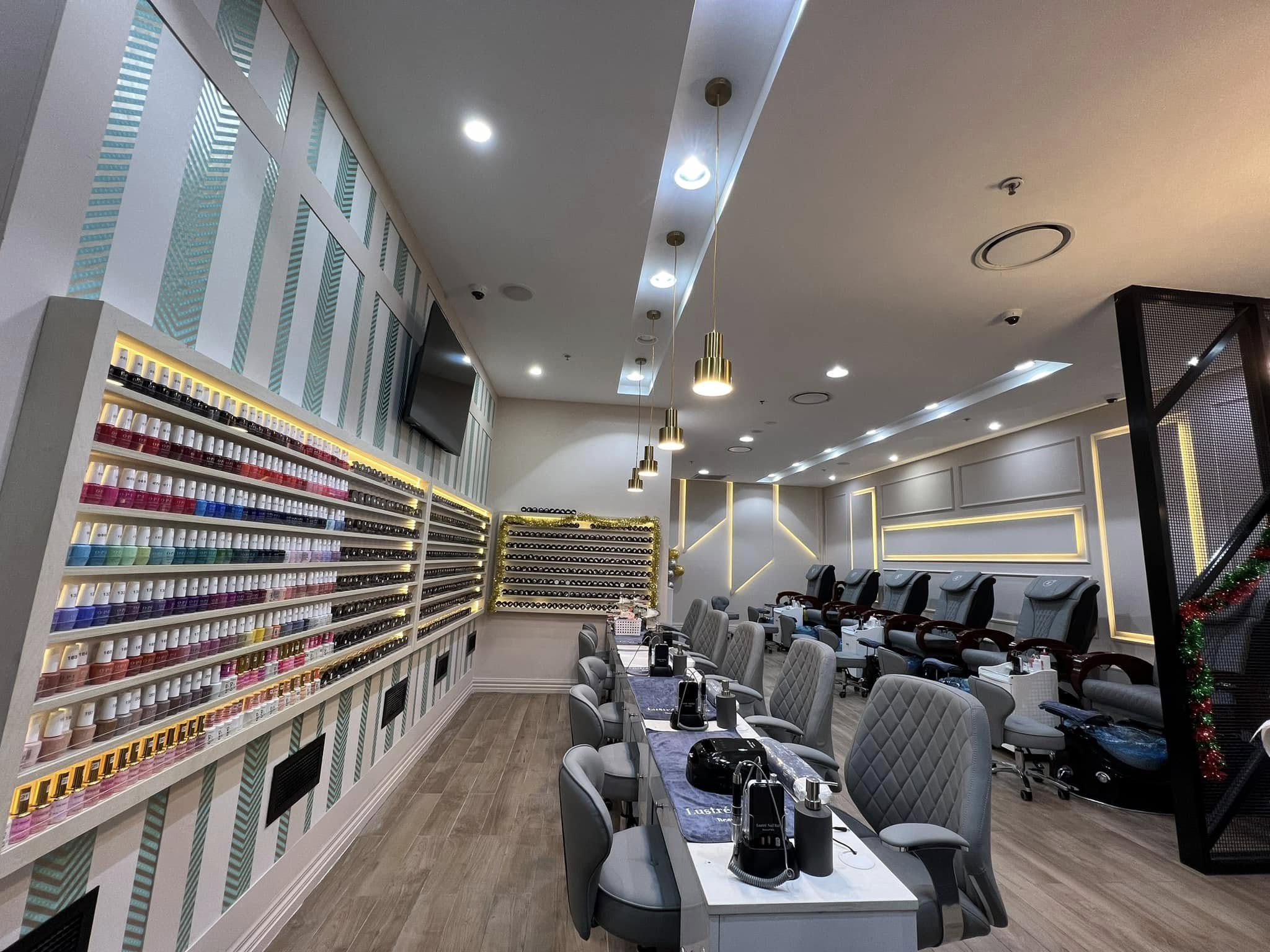 Nail colour wall and manicure stations at Lustre Nail Bar The Glen