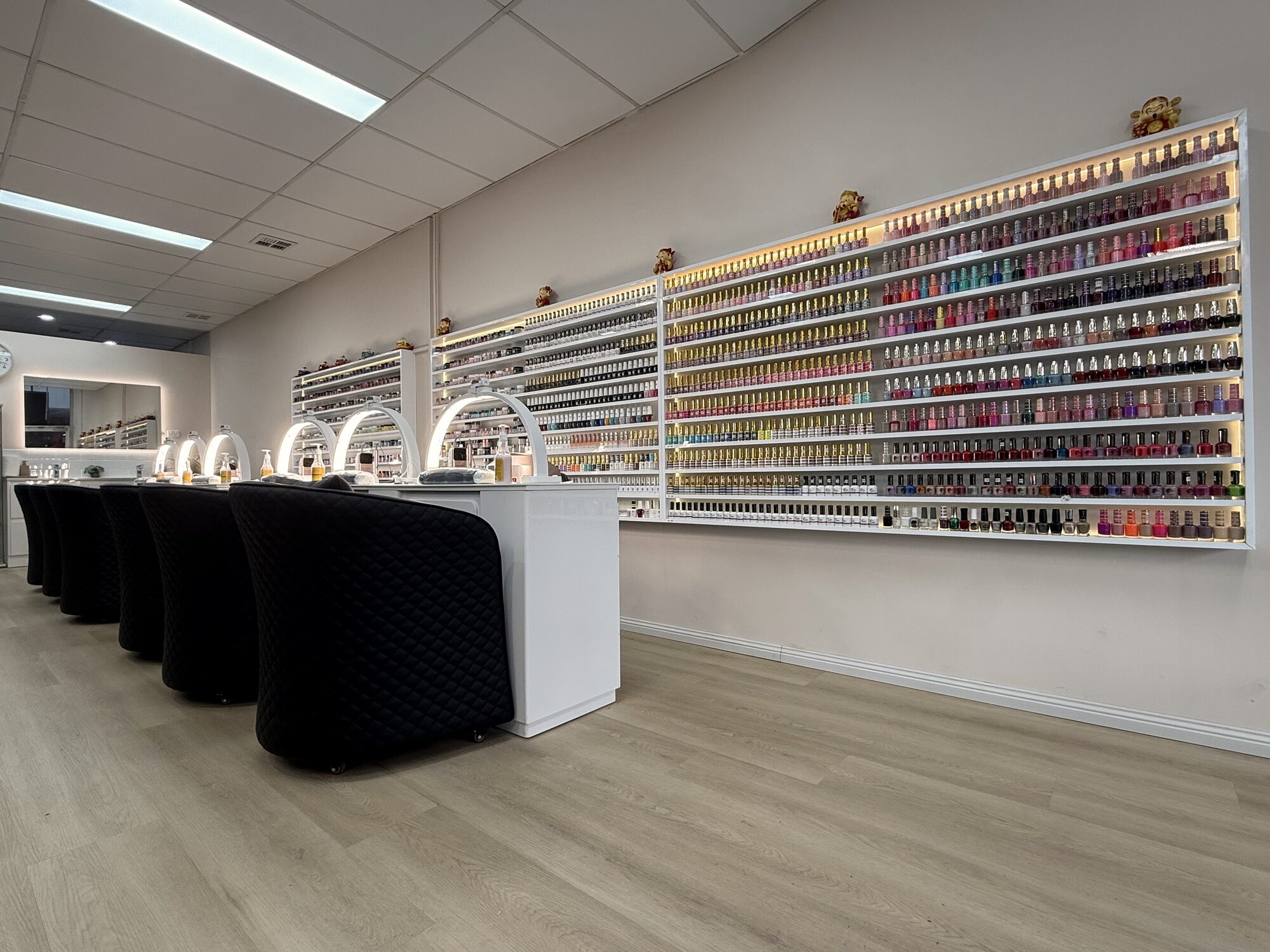 Manicure area and nail colour collection at Lustre Nail Bar Forest Hill